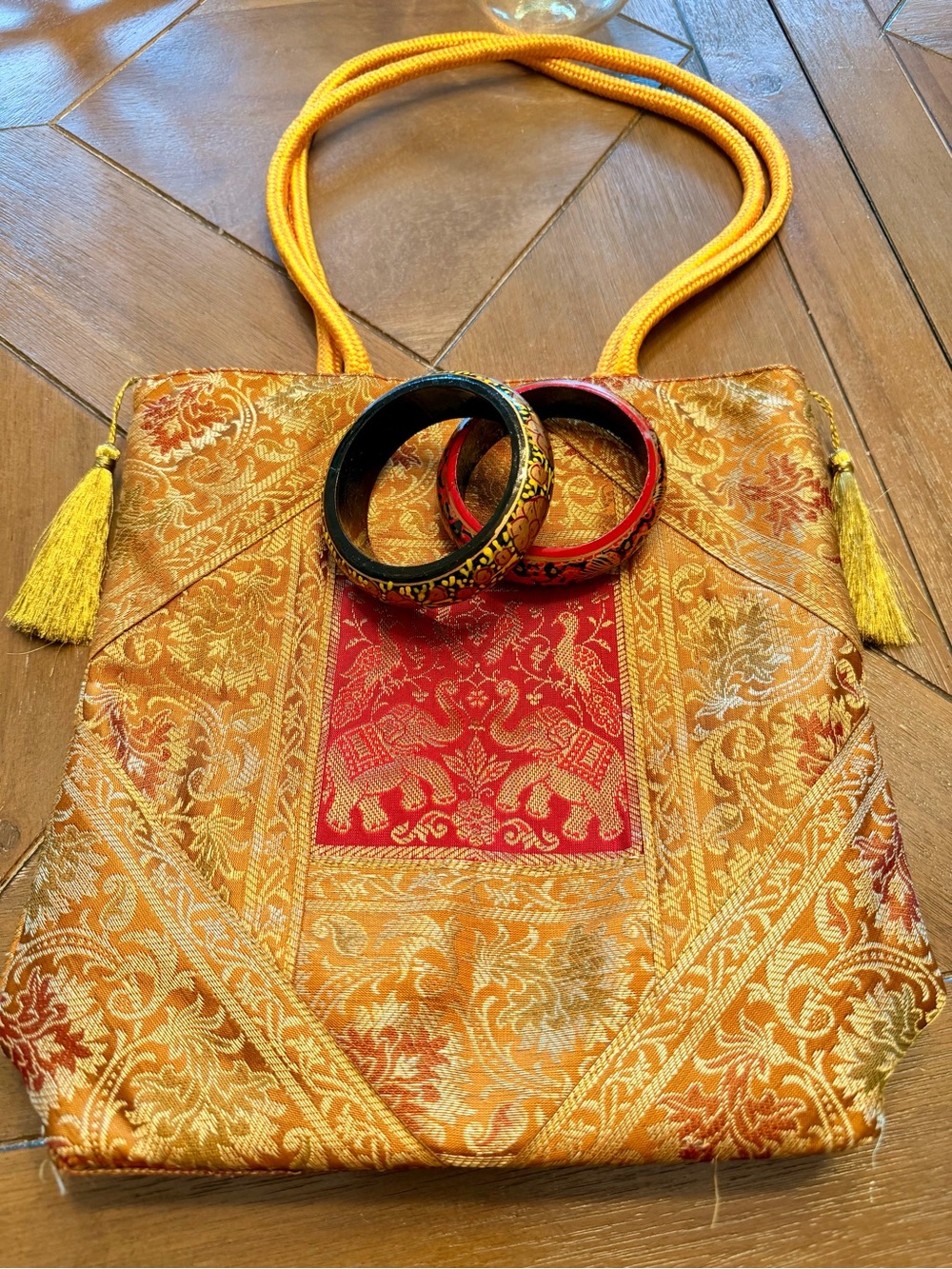 Banarasi Vastra golden zari woven shoulder bag and two wooden bangles